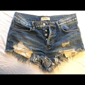 Free People medium-wash distressed shorts